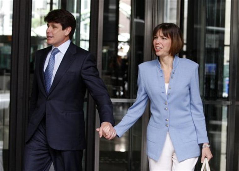 Rod Blagojevich and his wife Patti leave the Dirksen U.S. Courthouse, downtown Chicago, on Monday. A federal judge refused the defense's request to delay Blagojevich's corruption trial today.